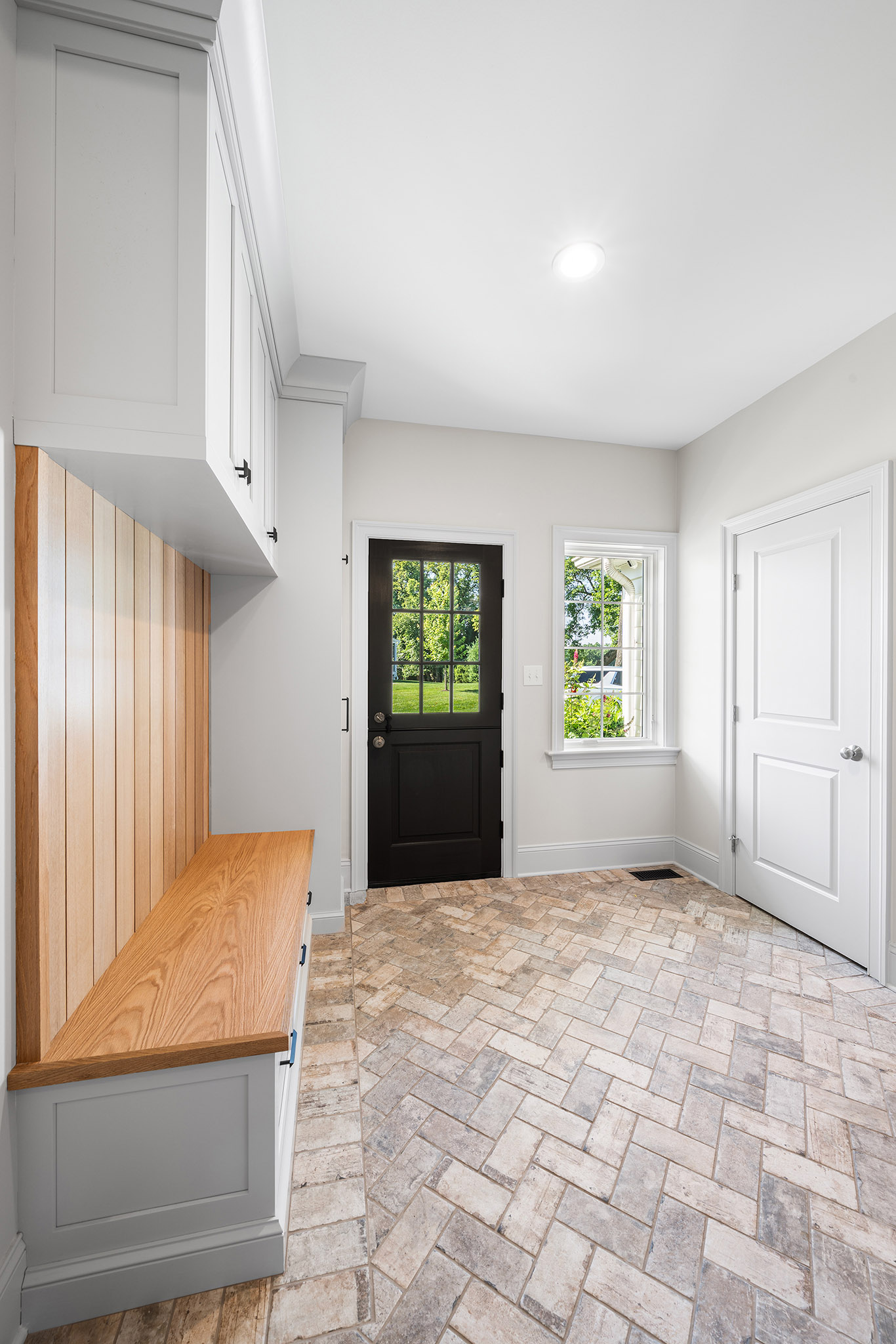 Domers Construction - Integrated and transformed unfinished garage and basement into indoor play area, mudroom, home gym, home brew bar, office, bathroom and bedroom