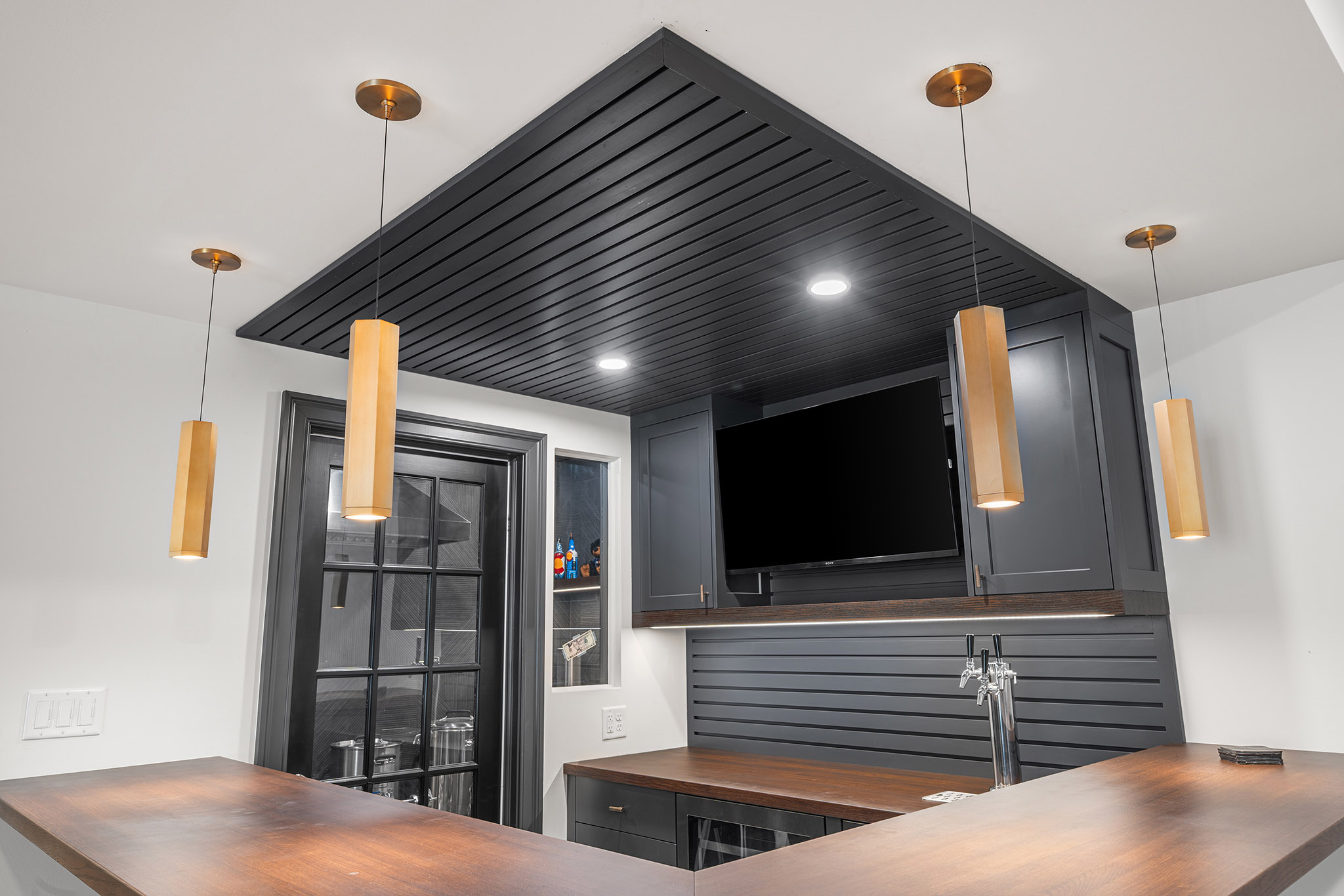 Domers Construction - Integrated and transformed unfinished garage and basement into indoor play area, mudroom, home gym, home brew bar, office, bathroom and bedroom